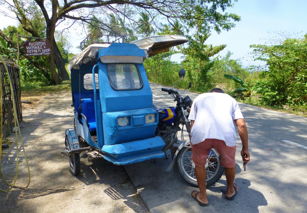 Having a flat tire with your tricycle, Moalboal - Phillipines