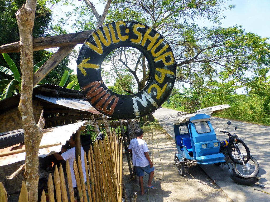 Having a flat tire with your tricycle, Moalboal - Phillipines