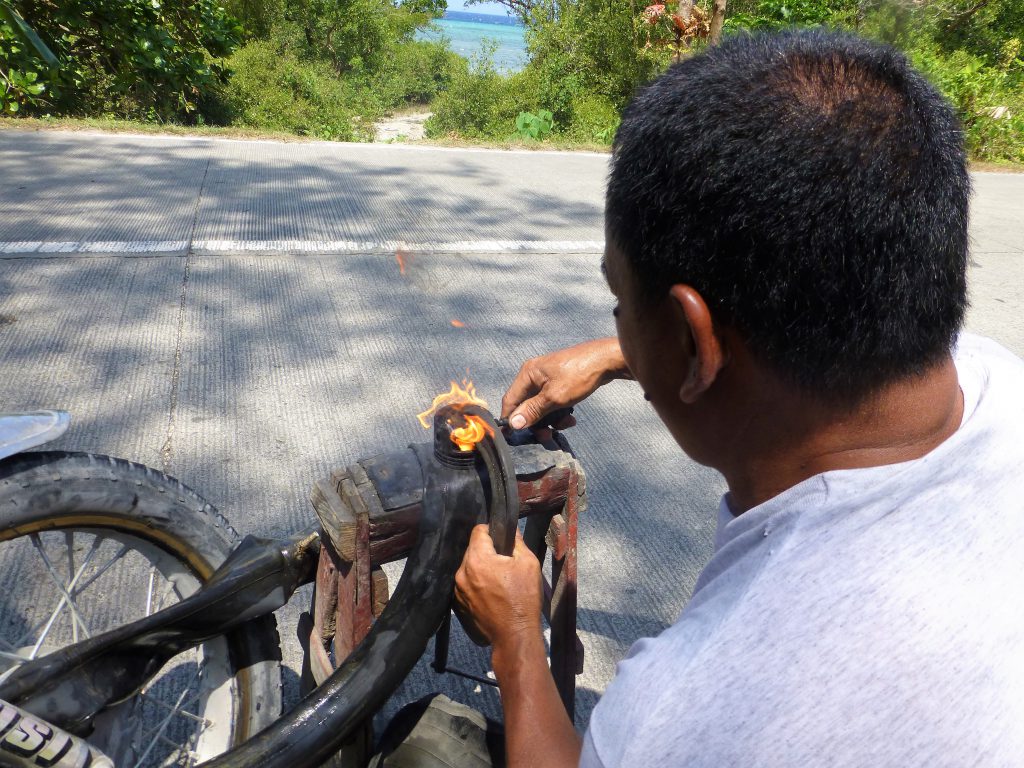 Having a flat tire with your tricycle, Moalboal - Phillipines
