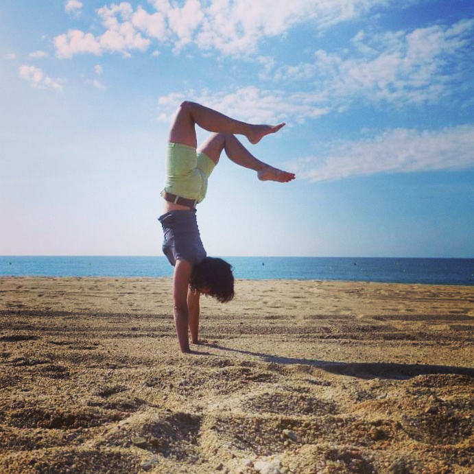 Handstand on the beach of Lloret de Mar, Spain